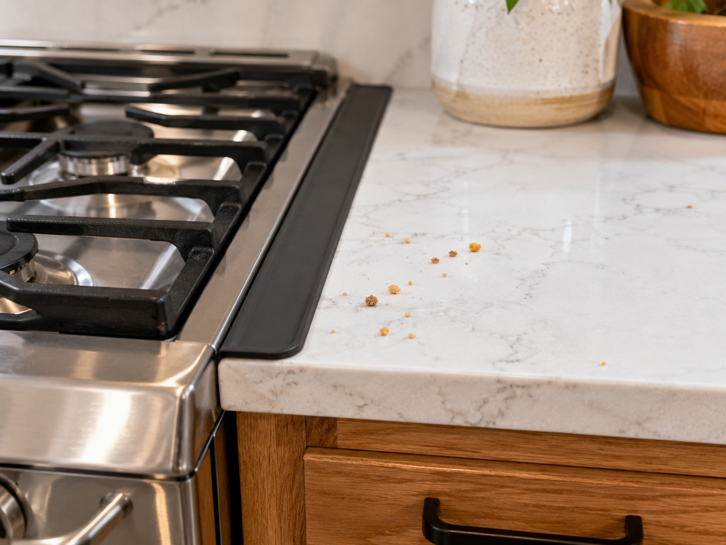 Silicone gap cover between a kitchen stove and quartz countertop